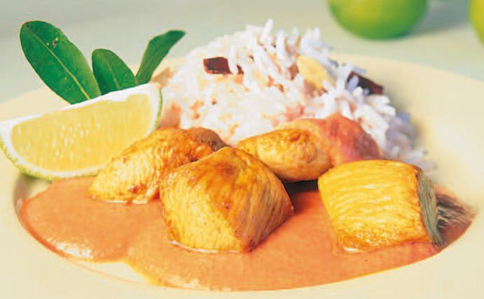 Putengeschnetzeltes in Joghurt-Paradeissauce mit Gewürzreis • Rezept